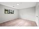 Bedroom with a window bringing in natural light, neutral paint, and carpeted floor at 6742 Cole Cir, Arvada, CO 80004