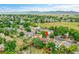 Aerial view of the neighborhood and backyard with mature trees at 10301 Owens Cir, Broomfield, CO 80021