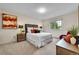 Cozy bedroom featuring plush carpeting, a comfortable bed, and natural light from the window at 10301 Owens Cir, Broomfield, CO 80021