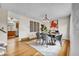 Bright dining room with hardwood floors, modern lighting, and decorative accents at 10301 Owens Cir, Broomfield, CO 80021