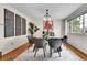 Elegant dining room featuring a sleek glass table, stylish chairs, and contemporary decor at 10301 Owens Cir, Broomfield, CO 80021