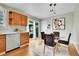 Eat-in kitchen area with views of the backyard, wood cabinets and hardwood floors at 10301 Owens Cir, Broomfield, CO 80021
