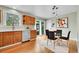 Eat-in kitchen area with views of the backyard, wood cabinets and hardwood floors at 10301 Owens Cir, Broomfield, CO 80021