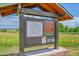 Community park sign and information at Standley Lake Regional Park near grassy lawn at 10301 Owens Cir, Broomfield, CO 80021