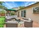 Inviting outdoor patio with comfortable seating, a green umbrella and a natural wood deck for relaxing at 10301 Owens Cir, Broomfield, CO 80021