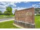 Sign for West View Recreation Center with brick and stone under a partly cloudy sky with green grass at 10301 Owens Cir, Broomfield, CO 80021