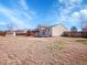 Expansive backyard featuring a wooden deck, shed, and ample space for outdoor activities, perfect for entertaining at 11535 Albion Ct, Thornton, CO 80233