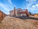 The large backyard and wooden deck create an inviting outdoor space, great for recreation or peaceful enjoyment at 11535 Albion Ct, Thornton, CO 80233