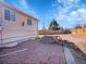 Spacious backyard with brick patio and outdoor fire pit at 11535 Albion Ct, Thornton, CO 80233