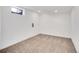 Finished basement features carpet flooring, neutral wall color, and natural light at 11535 Albion Ct, Thornton, CO 80233