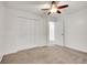 Bedroom featuring new carpet, fresh white paint, ceiling fan, and closet at 11535 Albion Ct, Thornton, CO 80233