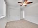 Bedroom featuring new carpet, fresh white paint, ceiling fan, and closet at 11535 Albion Ct, Thornton, CO 80233