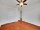 Bedroom featuring wood floors and a ceiling fan and standard closet at 11535 Albion Ct, Thornton, CO 80233