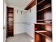 Walk-in closet features custom wooden shelving at 11535 Albion Ct, Thornton, CO 80233