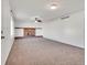 Open living room featuring a cozy brick fireplace and lots of natural light at 11535 Albion Ct, Thornton, CO 80233