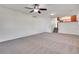 Spacious living room with a ceiling fan and entrance to the Kitchen at 11535 Albion Ct, Thornton, CO 80233