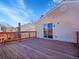 This wooden deck provides a place for outdoor enjoyment and has a sliding glass door for easy access to the house at 11535 Albion Ct, Thornton, CO 80233