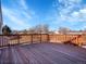 Spacious wooden deck provides great views of neighborhood and features a sturdy railing for outdoor relaxation and enjoyment at 11535 Albion Ct, Thornton, CO 80233