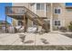 Backyard patio with stairs to a deck, and covered furniture at 4206 Eagle Ridge Way, Castle Rock, CO 80104