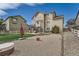 Large backyard with patio, upper deck, white fence, and low maintenance gravel area at 4206 Eagle Ridge Way, Castle Rock, CO 80104