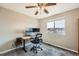 Bright bedroom featuring a ceiling fan, natural light, neutral walls, and a wooden desk with computer setup at 4206 Eagle Ridge Way, Castle Rock, CO 80104