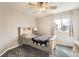 Bright bedroom with mountain-themed wooden bed frame and ceiling fan at 4206 Eagle Ridge Way, Castle Rock, CO 80104