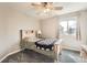 Cozy bedroom with carpet, neutral walls, and a single bed with wood frame with natural light at 4206 Eagle Ridge Way, Castle Rock, CO 80104