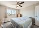 Bedroom with large window, gray carpet, and ceiling fan at 4206 Eagle Ridge Way, Castle Rock, CO 80104