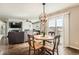 Bright dining area features hardwood floors, modern lighting fixture, and access to a patio overlooking scenic views at 4206 Eagle Ridge Way, Castle Rock, CO 80104