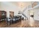 Elegant dining room with hardwood floors, staircase, and a large table with seating for eight at 4206 Eagle Ridge Way, Castle Rock, CO 80104