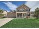 Charming two-story home featuring a covered porch, stone accents, and well-maintained landscaping at 4206 Eagle Ridge Way, Castle Rock, CO 80104