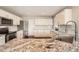 Spacious kitchen with granite countertops, stainless steel appliances, and island sink at 4206 Eagle Ridge Way, Castle Rock, CO 80104