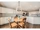 Open kitchen with a breakfast nook, white cabinetry, and stainless steel appliances at 4206 Eagle Ridge Way, Castle Rock, CO 80104