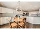 Bright kitchen with white cabinets, stainless steel appliances, and a cozy breakfast nook at 4206 Eagle Ridge Way, Castle Rock, CO 80104