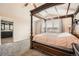 The main bedroom features a four-poster bed and soft carpet, with an ensuite bathroom at 4206 Eagle Ridge Way, Castle Rock, CO 80104