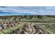 A suburban street with well-kept homes and green hills in the background on a sunny day at 4206 Eagle Ridge Way, Castle Rock, CO 80104