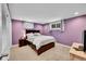 Comfortable bedroom with soft carpet, two windows, and a queen-sized bed with stylish bedding at 12286 W Tennessee, Lakewood, CO 80228