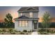 Charming two-story home with gray siding, modern windows, and professionally landscaped front yard, perfect for families at 2124 Chambers Rd, Brighton, CO 80601