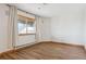 Cozy bedroom with wood floors and a large window at 371 Buckskin Ct, Parker, CO 80138