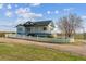 Charming two-story home with a white picket fence and inviting front porch at 371 Buckskin Ct, Parker, CO 80138