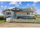 Beautiful home with a welcoming porch and a classic white picket fence at 371 Buckskin Ct, Parker, CO 80138