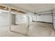 Unfinished garage with a door at 371 Buckskin Ct, Parker, CO 80138