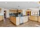 Large kitchen island with granite countertops, stainless steel appliances, and an open layout to the adjacent living area at 371 Buckskin Ct, Parker, CO 80138
