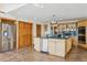 Spacious kitchen with granite countertops, stainless steel appliances, and a large island at 371 Buckskin Ct, Parker, CO 80138