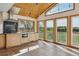 Bright kitchen with stainless appliances, and scenic views, featuring a unique vaulted ceiling and a view of the balcony at 371 Buckskin Ct, Parker, CO 80138