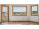 Inviting living room showcasing expansive windows providing natural light and scenic views of the surrounding landscape at 371 Buckskin Ct, Parker, CO 80138