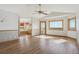 Open bedroom area with hardwood floors, natural light, and ensuite bathroom at 371 Buckskin Ct, Parker, CO 80138