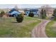 Spacious property featuring a home and a long, winding driveway at 371 Buckskin Ct, Parker, CO 80138