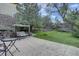 Backyard with patio, swing bench, a lawn area with cornhole game, landscaping, and privacy fencing at 24556 E Ottawa Ave, Aurora, CO 80016