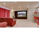 Finished basement with projector screen displaying the home's front elevation at 24556 E Ottawa Ave, Aurora, CO 80016